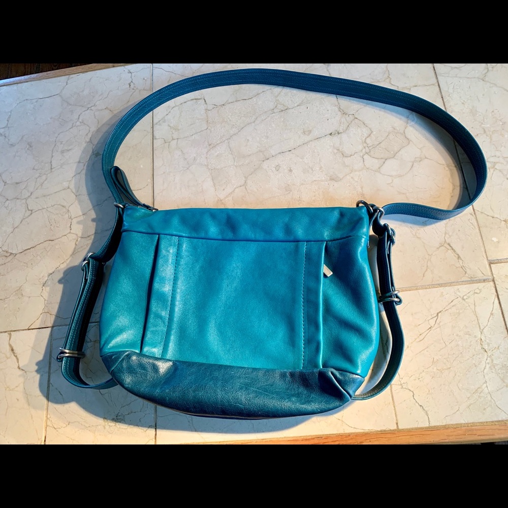 ROUGH AND TUMBLE-CONVERTIBLE SHOULDER BAG/BACKPACK